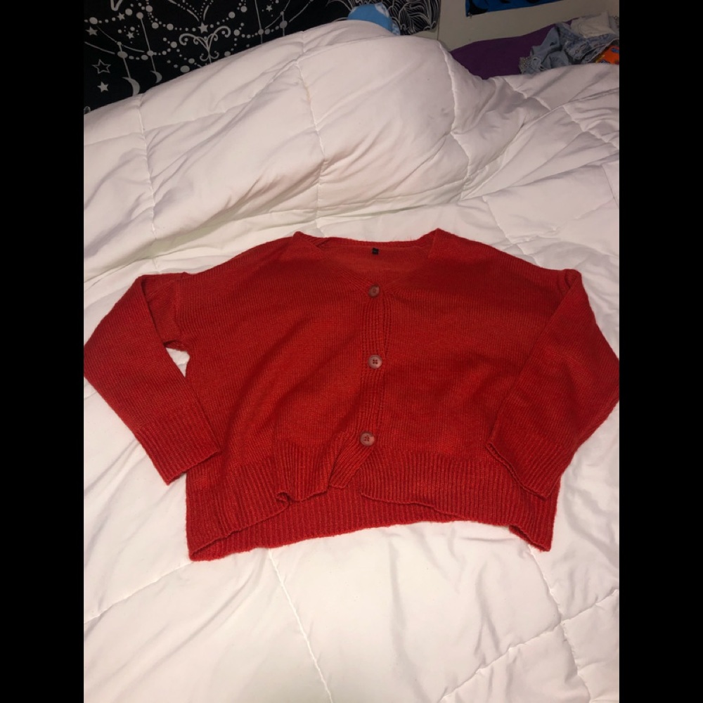 Red /orange colored sweater